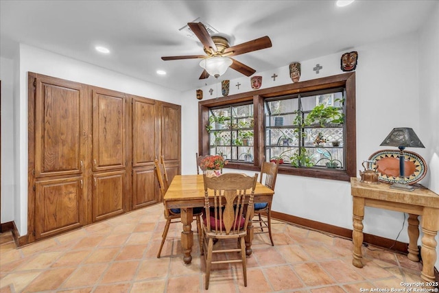 dining area with ceiling fan and light tile patterned floors