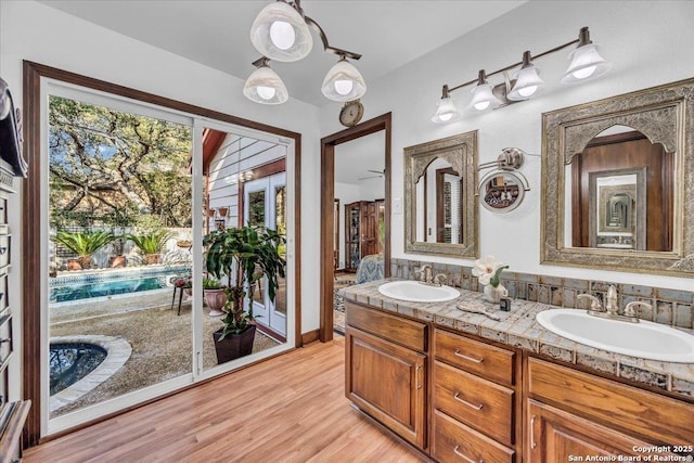 bathroom with vanity and wood-type flooring