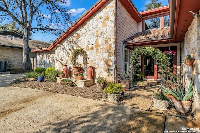 view of side of property with a patio