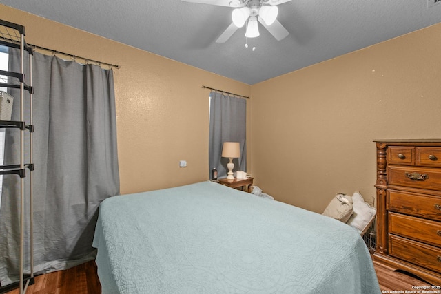 bedroom featuring wood-type flooring and ceiling fan