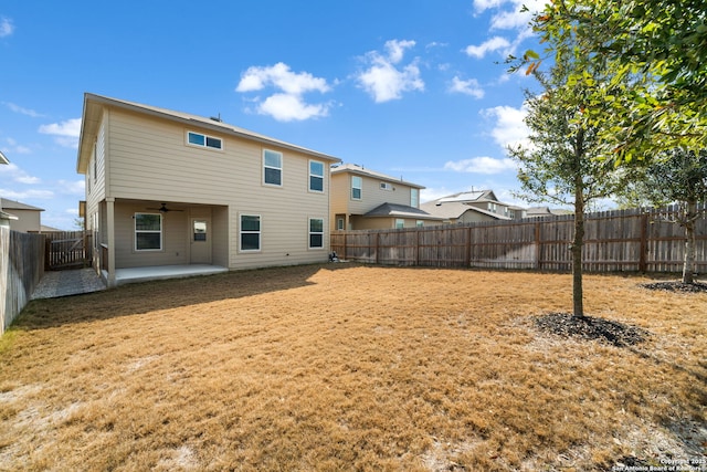 back of house featuring ceiling fan and a patio area