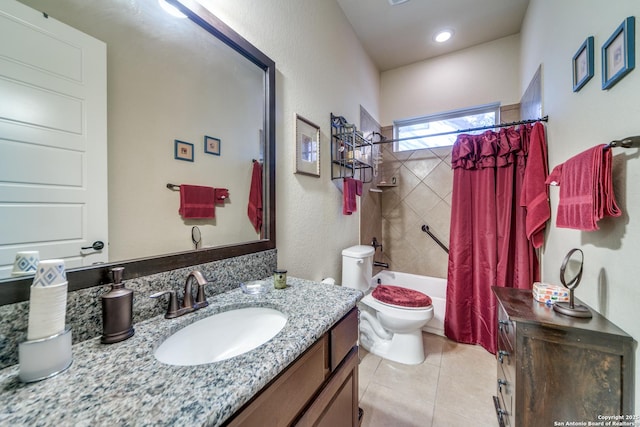 full bathroom featuring shower / bath combo, vanity, tile patterned floors, and toilet