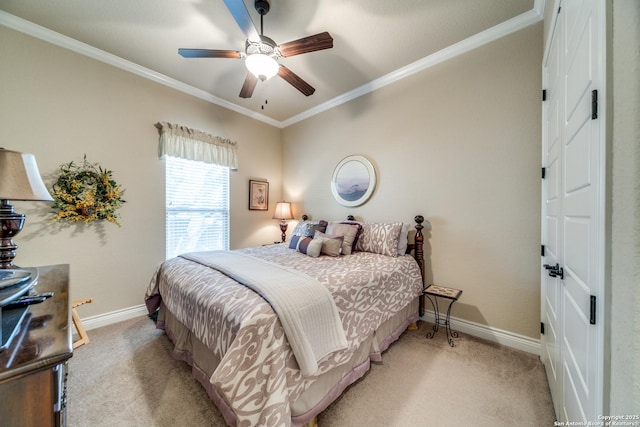 carpeted bedroom with crown molding and ceiling fan