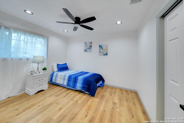 bedroom featuring ceiling fan and light hardwood / wood-style floors