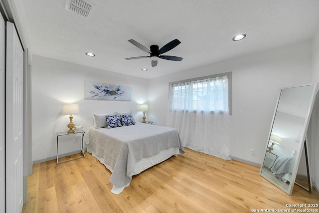 bedroom featuring ceiling fan and wood-type flooring