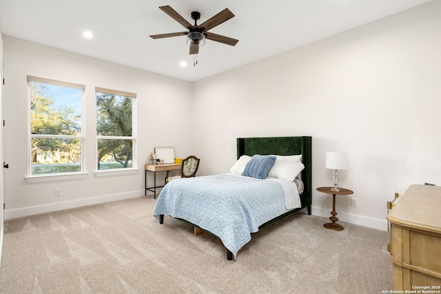 bedroom with ceiling fan and light colored carpet