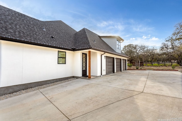 view of property exterior with a garage