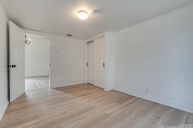 unfurnished room featuring light hardwood / wood-style flooring