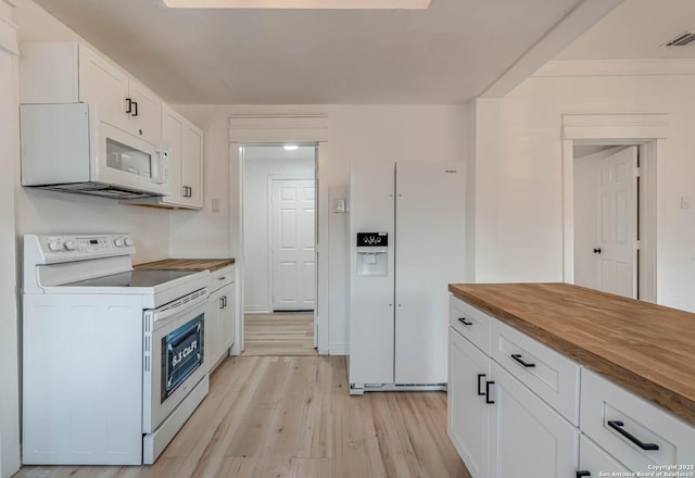 kitchen with white cabinetry, white appliances, light hardwood / wood-style floors, and butcher block countertops