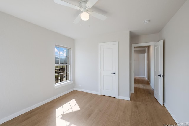 unfurnished bedroom featuring ceiling fan and light hardwood / wood-style flooring