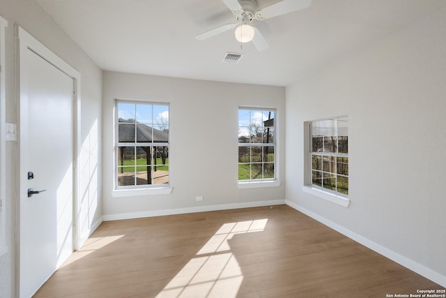 unfurnished room with ceiling fan and light wood-type flooring