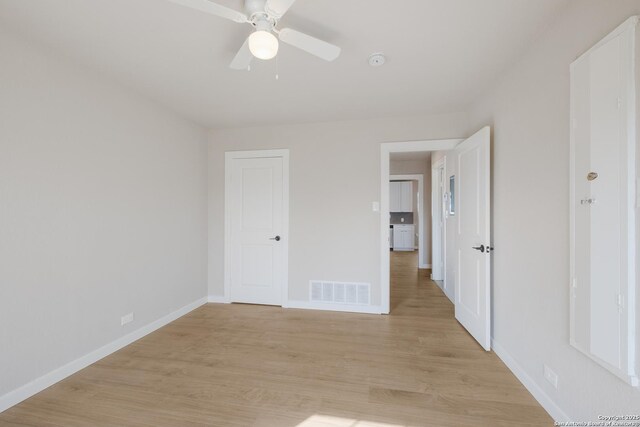 unfurnished bedroom featuring ceiling fan and light hardwood / wood-style floors