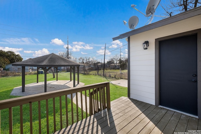 wooden deck with a gazebo and a yard