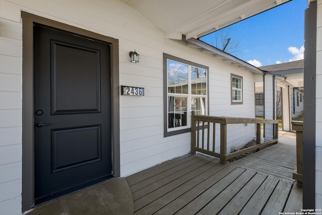 view of exterior entry with covered porch