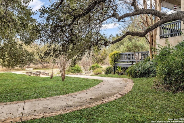 view of home's community featuring a lawn