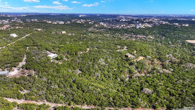 birds eye view of property with a wooded view