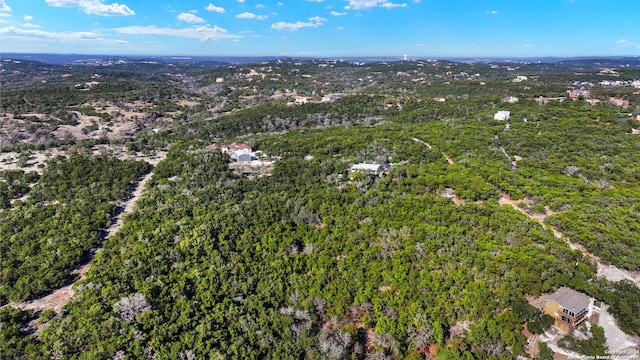 aerial view featuring a wooded view