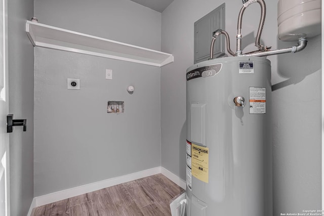 utility room featuring water heater