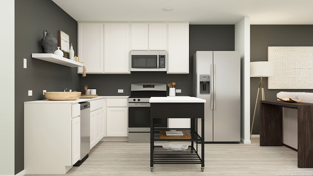 kitchen with stainless steel appliances, white cabinets, and light hardwood / wood-style flooring