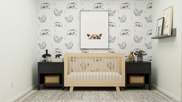 unfurnished bedroom featuring a nursery area