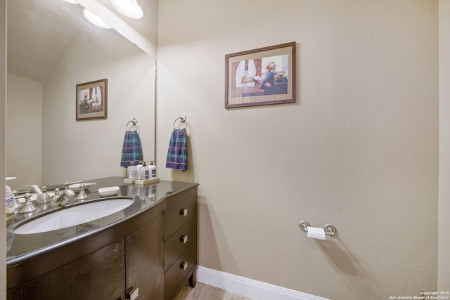 bathroom with vanity and vaulted ceiling