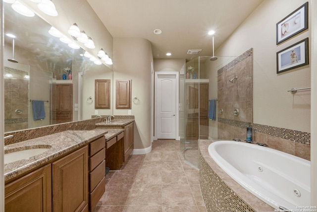 bathroom featuring vanity and independent shower and bath