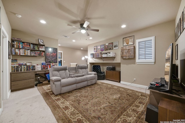 living room with carpet floors and ceiling fan