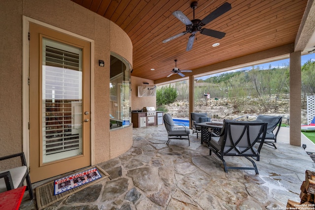 view of patio featuring grilling area and ceiling fan