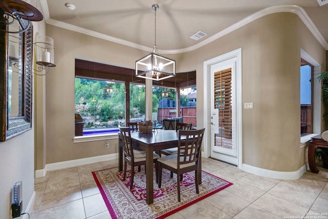 dining room featuring an inviting chandelier, light tile patterned floors, and ornamental molding