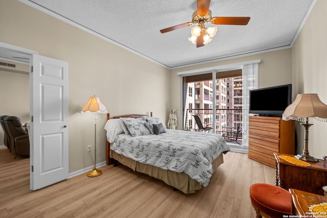 bedroom with light hardwood / wood-style flooring, a textured ceiling, ornamental molding, ceiling fan, and access to exterior