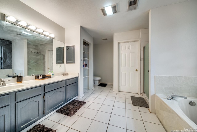 full bathroom featuring vanity, toilet, independent shower and bath, and tile patterned flooring