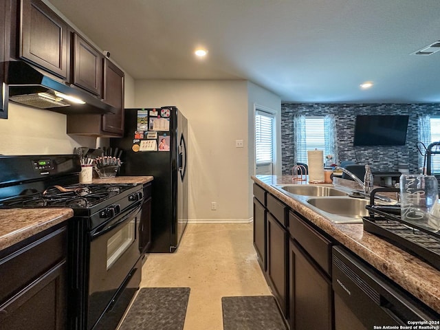 kitchen featuring sink, dark brown cabinets, and black appliances