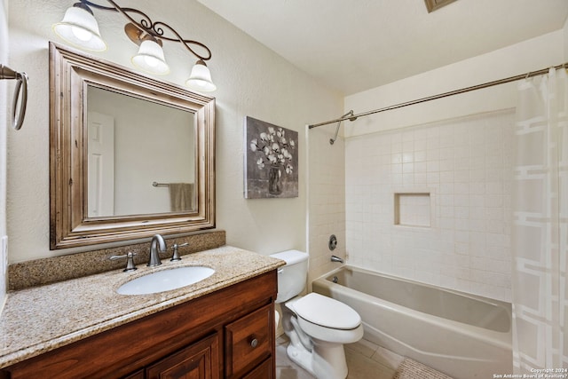 full bathroom featuring tile patterned flooring, vanity, toilet, and tiled shower / bath