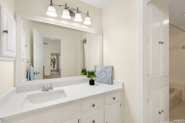 bathroom with vanity and  shower combination