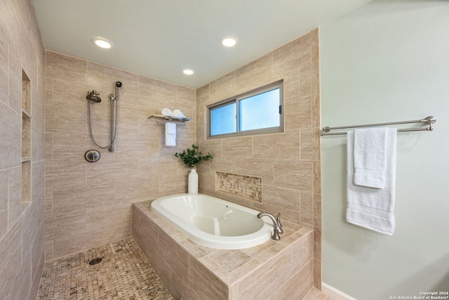 bathroom with separate shower and tub