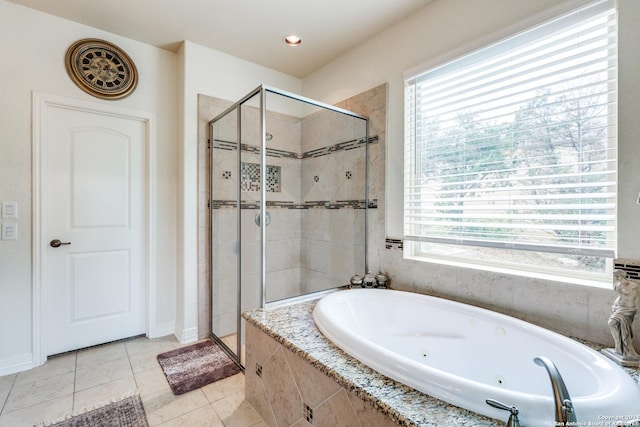 bathroom featuring plus walk in shower and tile patterned flooring