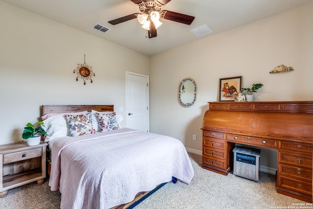 bedroom with ceiling fan and light carpet