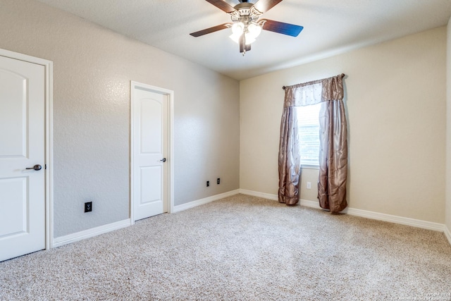 unfurnished room with carpet floors and ceiling fan