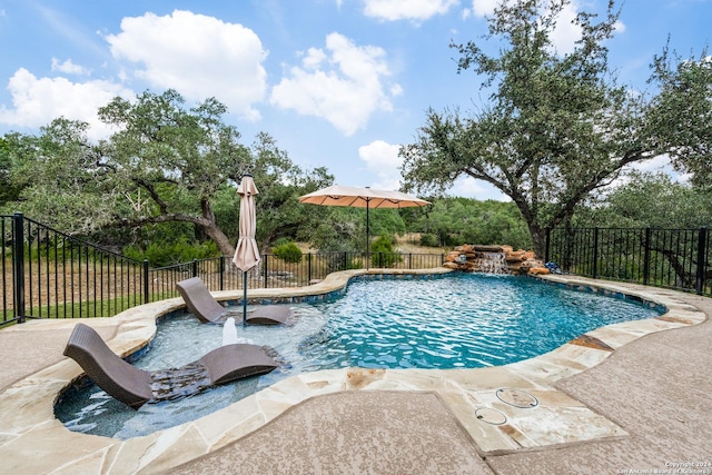 view of swimming pool featuring a patio area and pool water feature