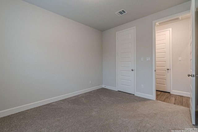 unfurnished bedroom with light carpet