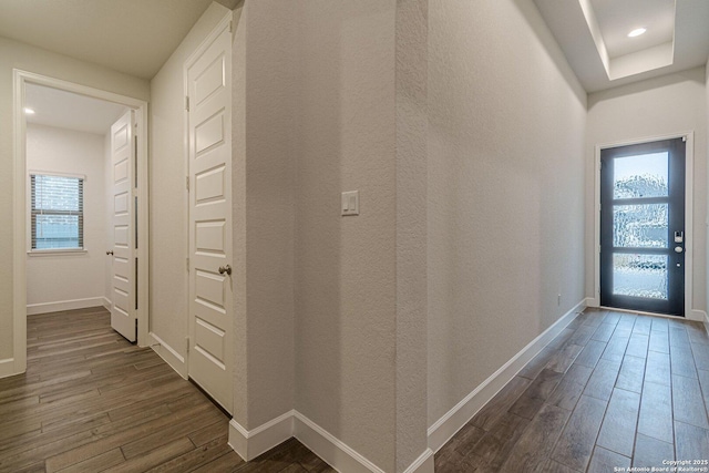 hallway featuring dark wood-type flooring