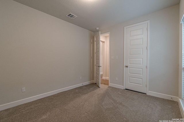 unfurnished bedroom featuring carpet flooring