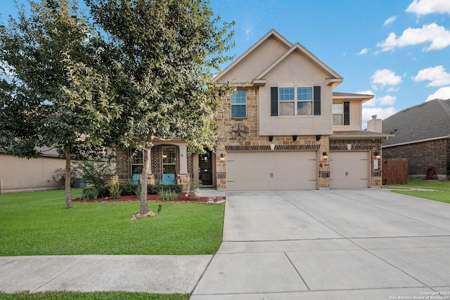 view of front of house featuring a garage and a front yard