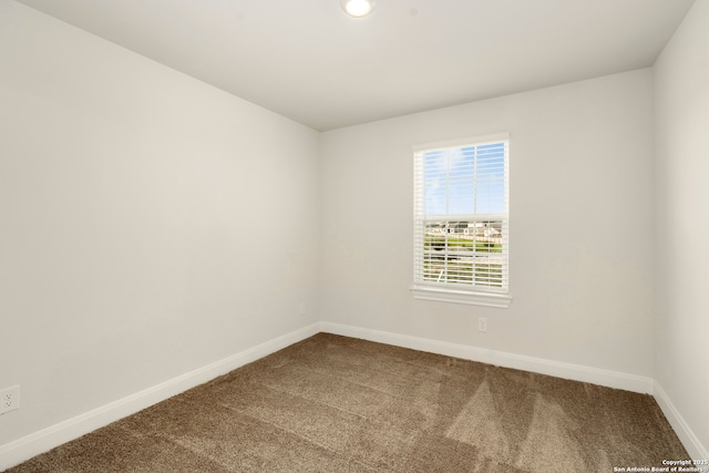 unfurnished room featuring carpet flooring