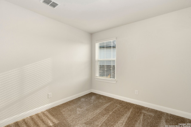 empty room featuring carpet floors