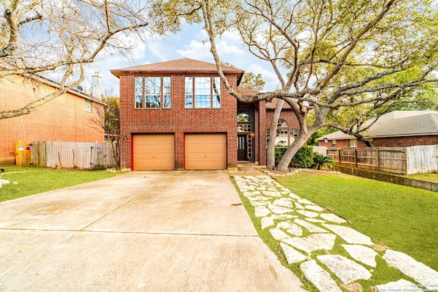 view of front facade with a garage and a front yard