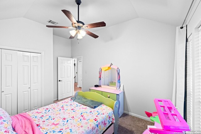 carpeted bedroom with lofted ceiling, ceiling fan, and a closet