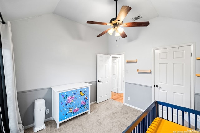 bedroom with light carpet, vaulted ceiling, and ceiling fan