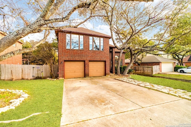 view of front of home featuring a garage and a front lawn