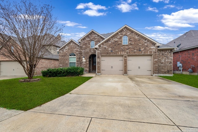 front facade with a garage and a front lawn